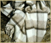 A woollen throw woven from natural undyed Jacob sheep wool by Cotswold Woollen Weavers in Filkins